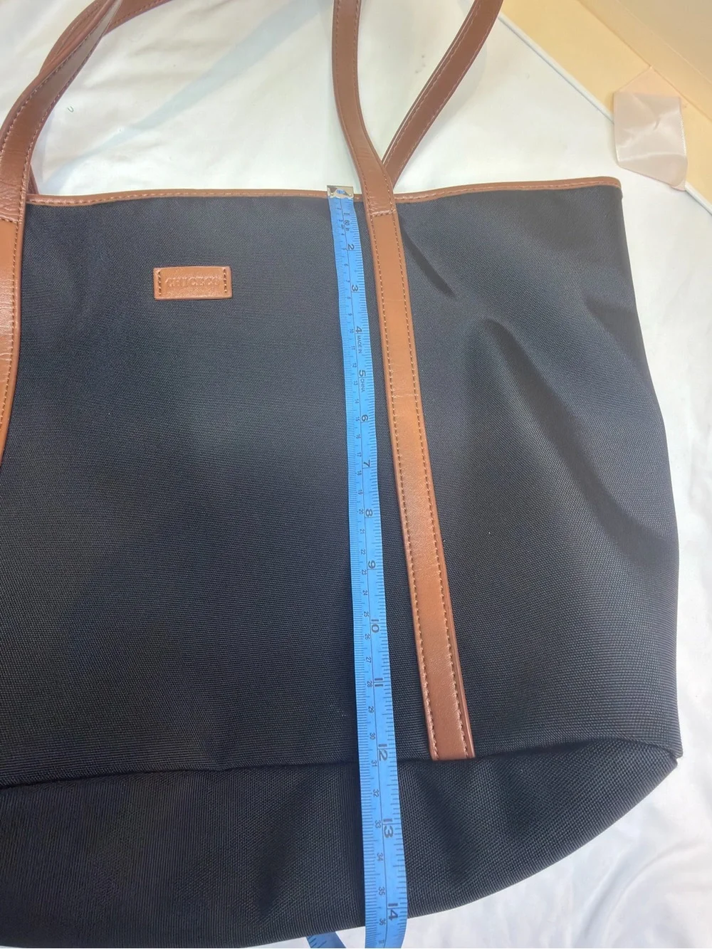 chic Black Tote with Brown Trim and Straps - Classic Two-Tone Carryall